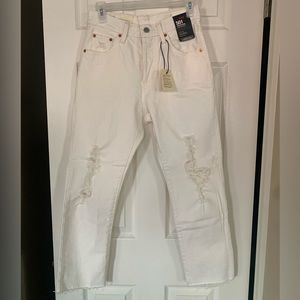 Levi’s 501 distressed white jeans